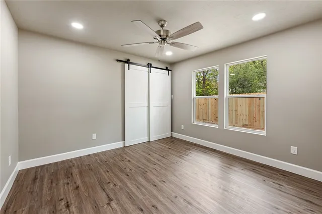 an outdoor view of balcony with wooden floor