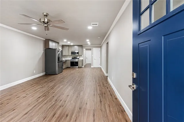wooden floor in an empty room with a window