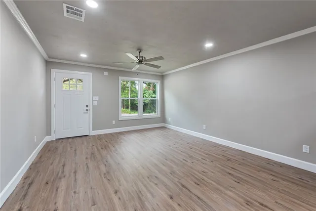 a kitchen with stainless steel appliances a refrigerator and a stove top oven