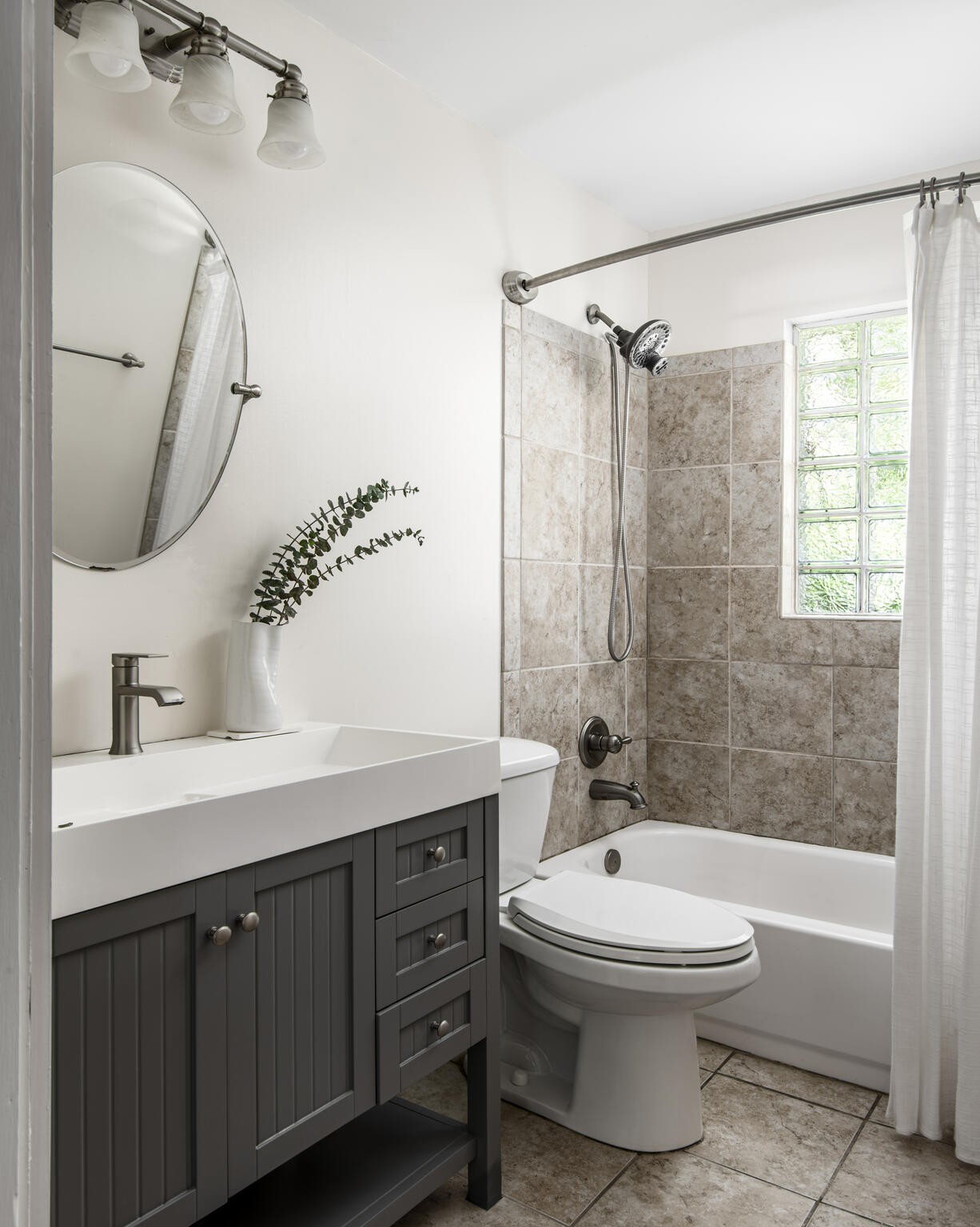 3815 Trimble Road Nashville, TN 37215 - Photo 19 of 31 a bathroom with a sink a toilet and shower