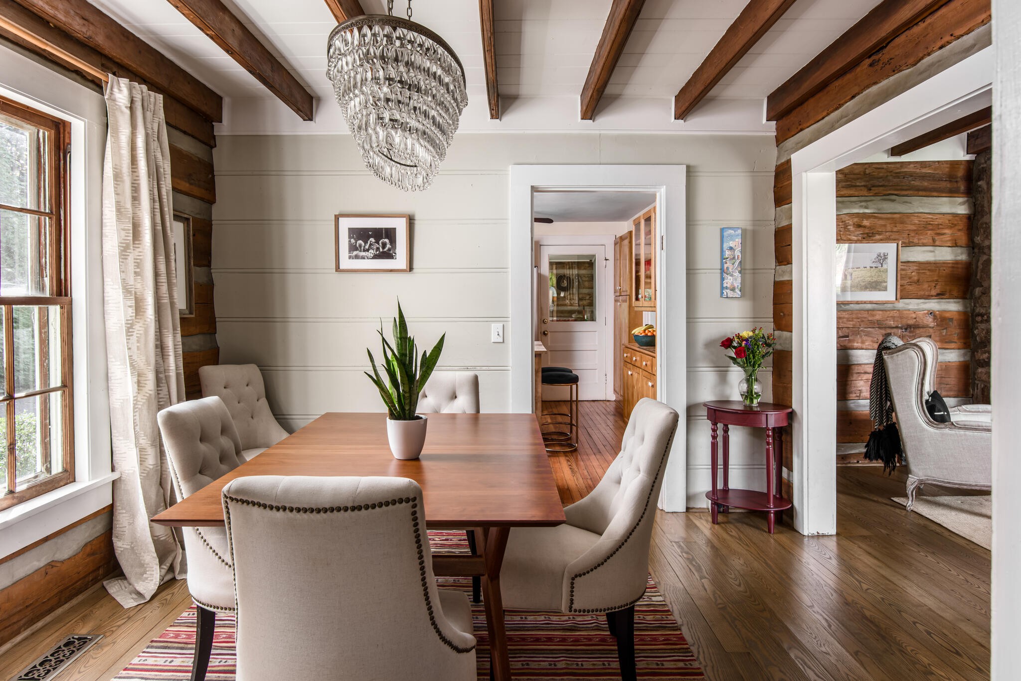 3815 Trimble Road Nashville, TN 37215 - Photo 9 of 31 a dining room with furniture wooden floor a potted plant and a chandelier