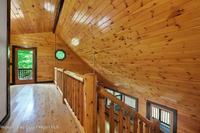 a view of a porch with wooden floor
