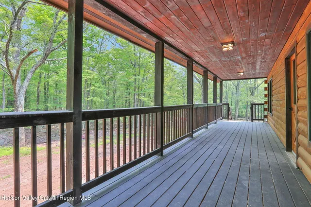 a view of porch with wooden floor