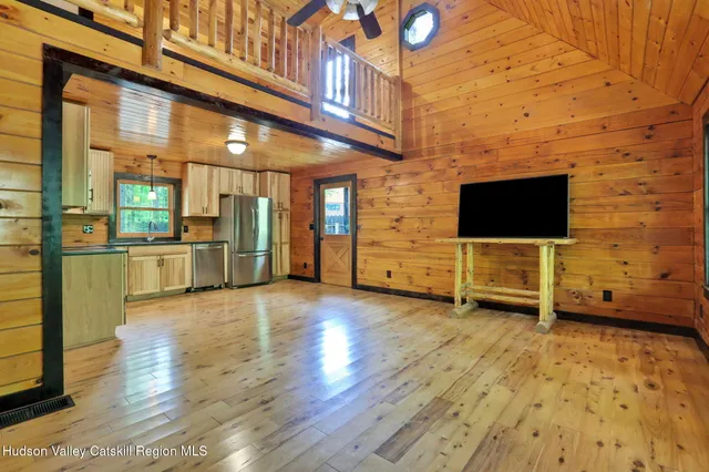 a view of a living room with a flat screen tv