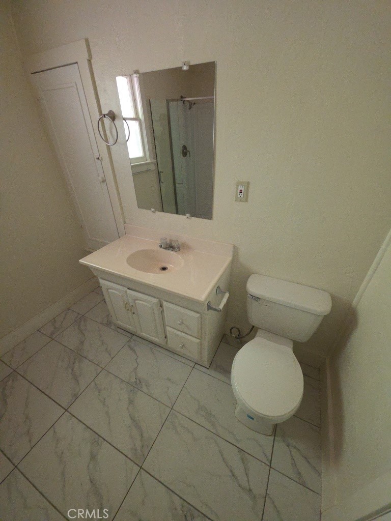 9633 Middle Creek Road Upper Lake, CA 95485 - Photo 12 of 18 a bathroom with a toilet sink and mirror