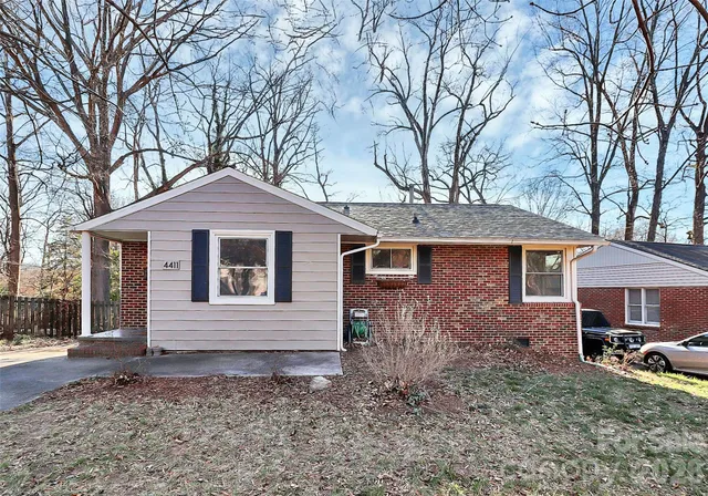 a front view of a house with yard