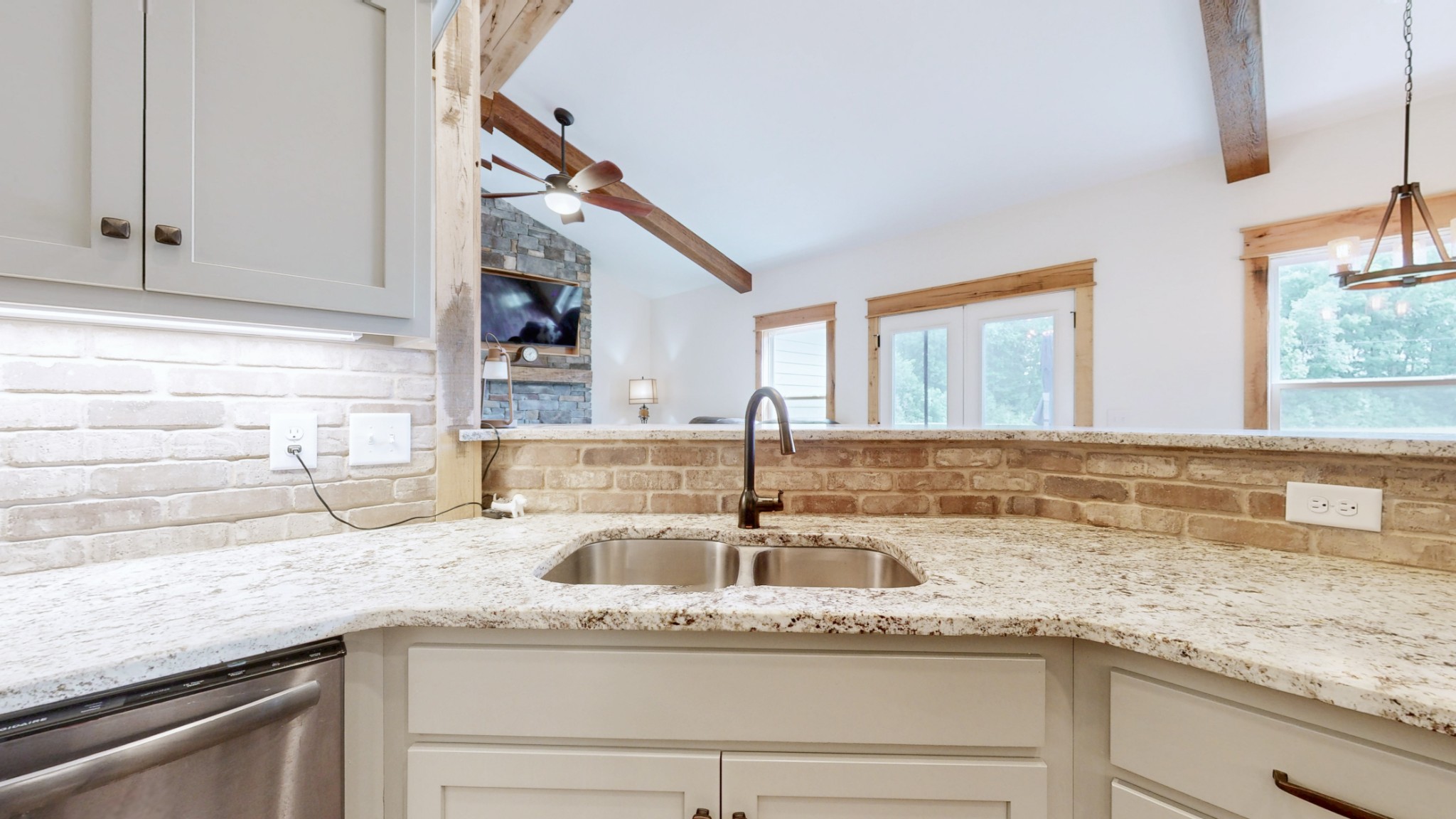 601 King Ridge Road Dowelltown, TN 37059 - Photo 18 of 49 a kitchen with granite countertop a sink and cabinets