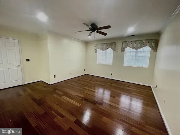 a living room with furniture flat screen tv and a fireplace