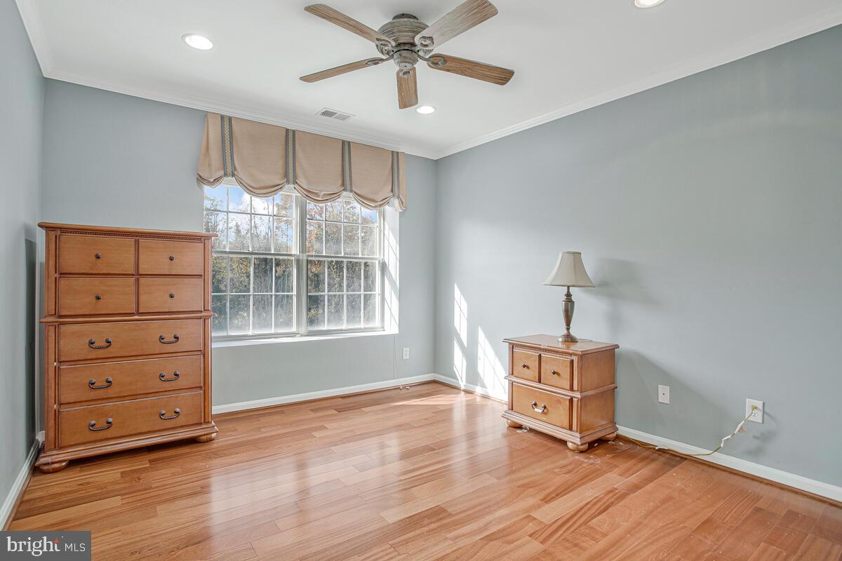 12300 Rosslare Ridge Road, Unit 508 Lutherville-Timonium, MD 21093 - Photo 31 of 40 a room with furniture and wooden floor