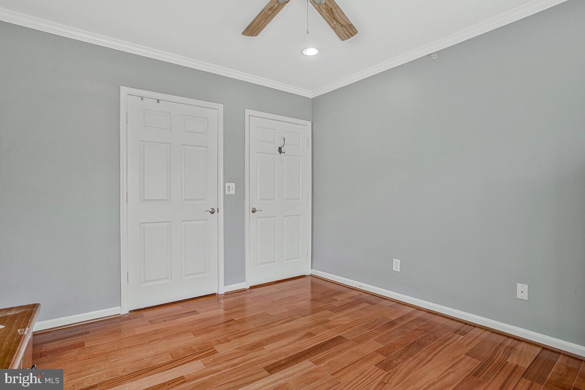 12300 Rosslare Ridge Road, Unit 508 Lutherville-Timonium, MD 21093 - Photo 32 of 40 a view of an empty room with wooden floor