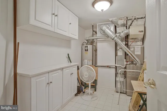a view of storage and utility room with racks on the wall