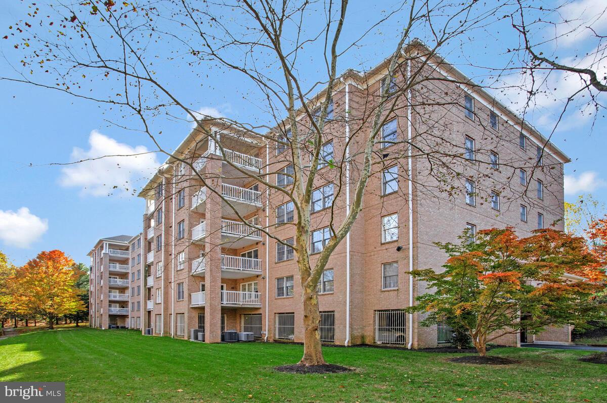 12300 Rosslare Ridge Road, Unit 508 Lutherville-Timonium, MD 21093 - Photo 6 of 40 a large building with a trees in front of it
