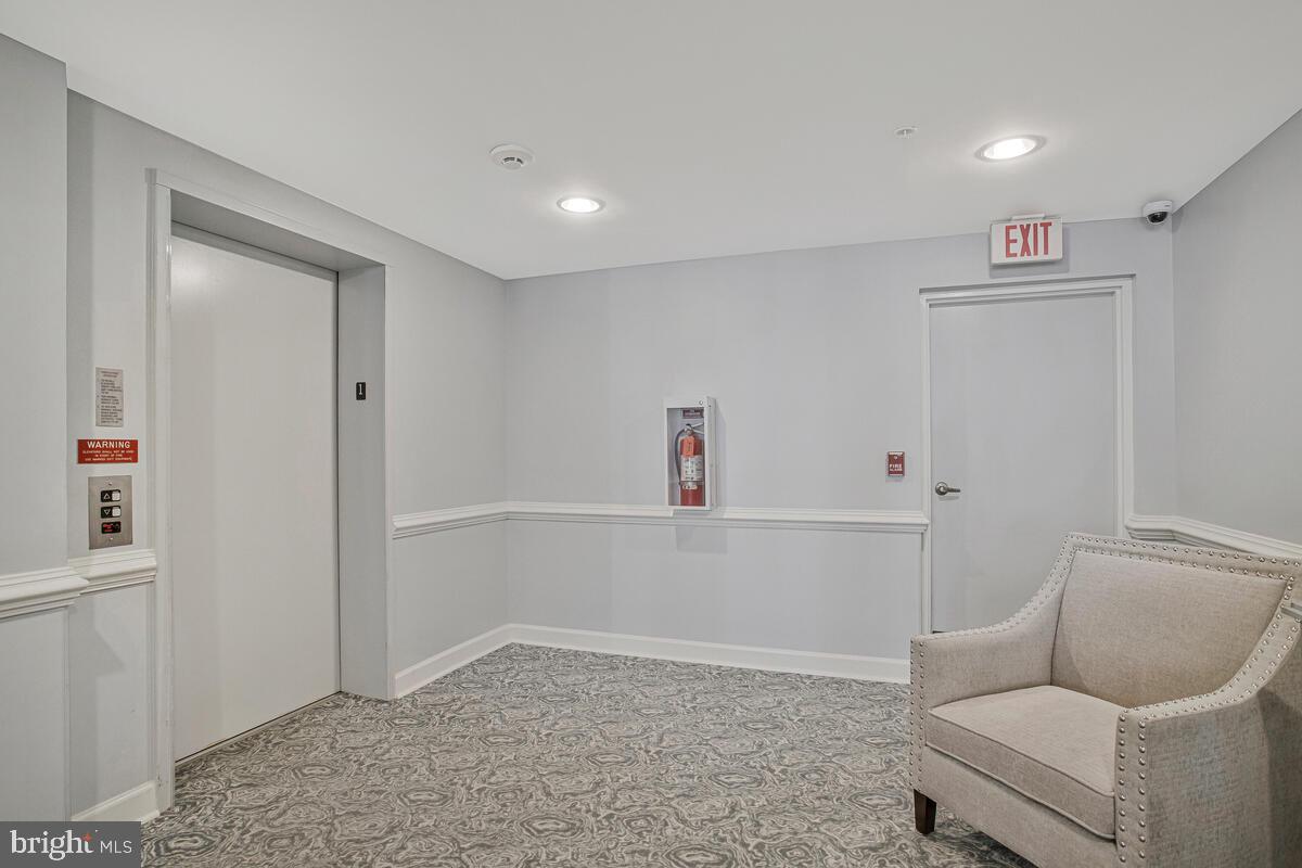 12300 Rosslare Ridge Road, Unit 508 Lutherville-Timonium, MD 21093 - Photo 8 of 40 a living room with furniture and a window