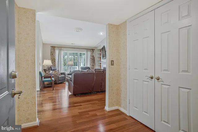 a living room with furniture window and wooden floor
