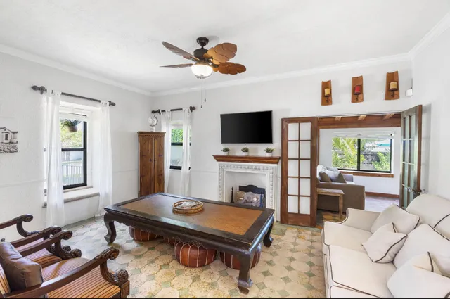 a living room with furniture and a flat screen tv