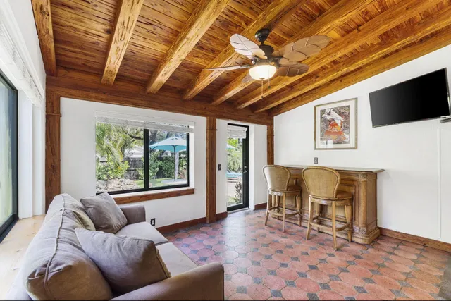 a view of a dining room with furniture wooden floor and chandelier