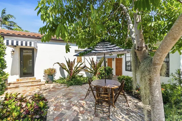 a view of a pathway along the house