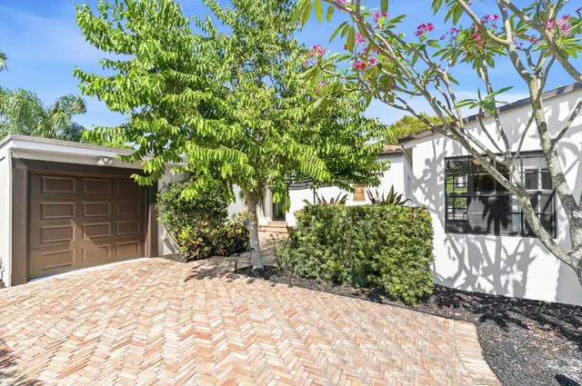 a kitchen with stainless steel appliances a refrigerator stove and white cabinets