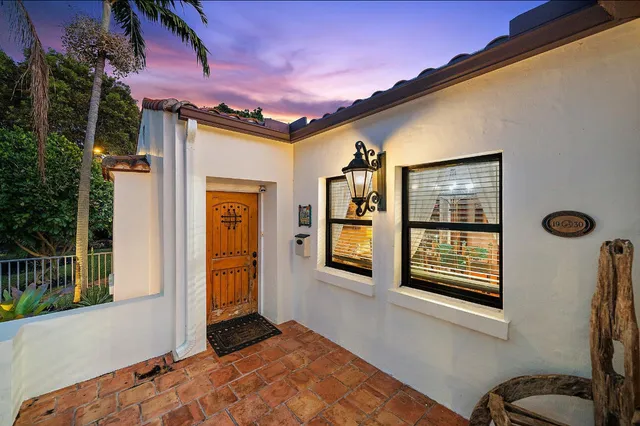 a front view of a house with a large window