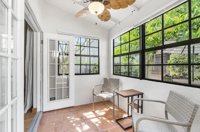 a view of a backyard with sitting area
