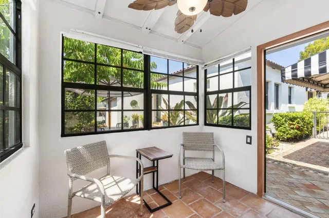 a swimming pool with outdoor seating and yard