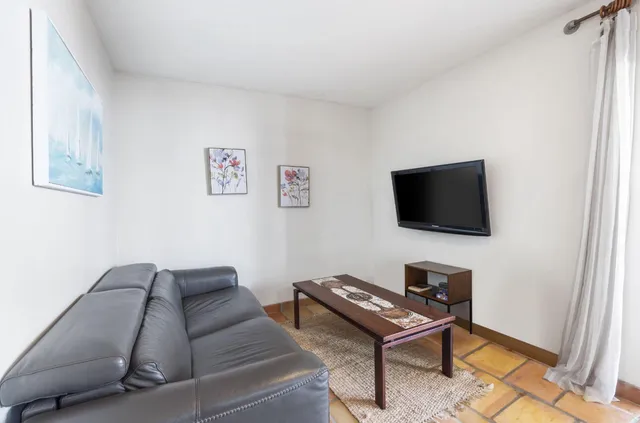 an aerial view of a house with a swimming pool and outdoor space