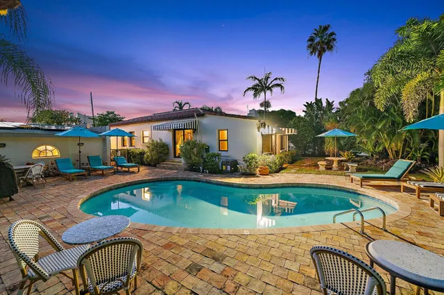 a view of a swimming pool with a lounge chairs