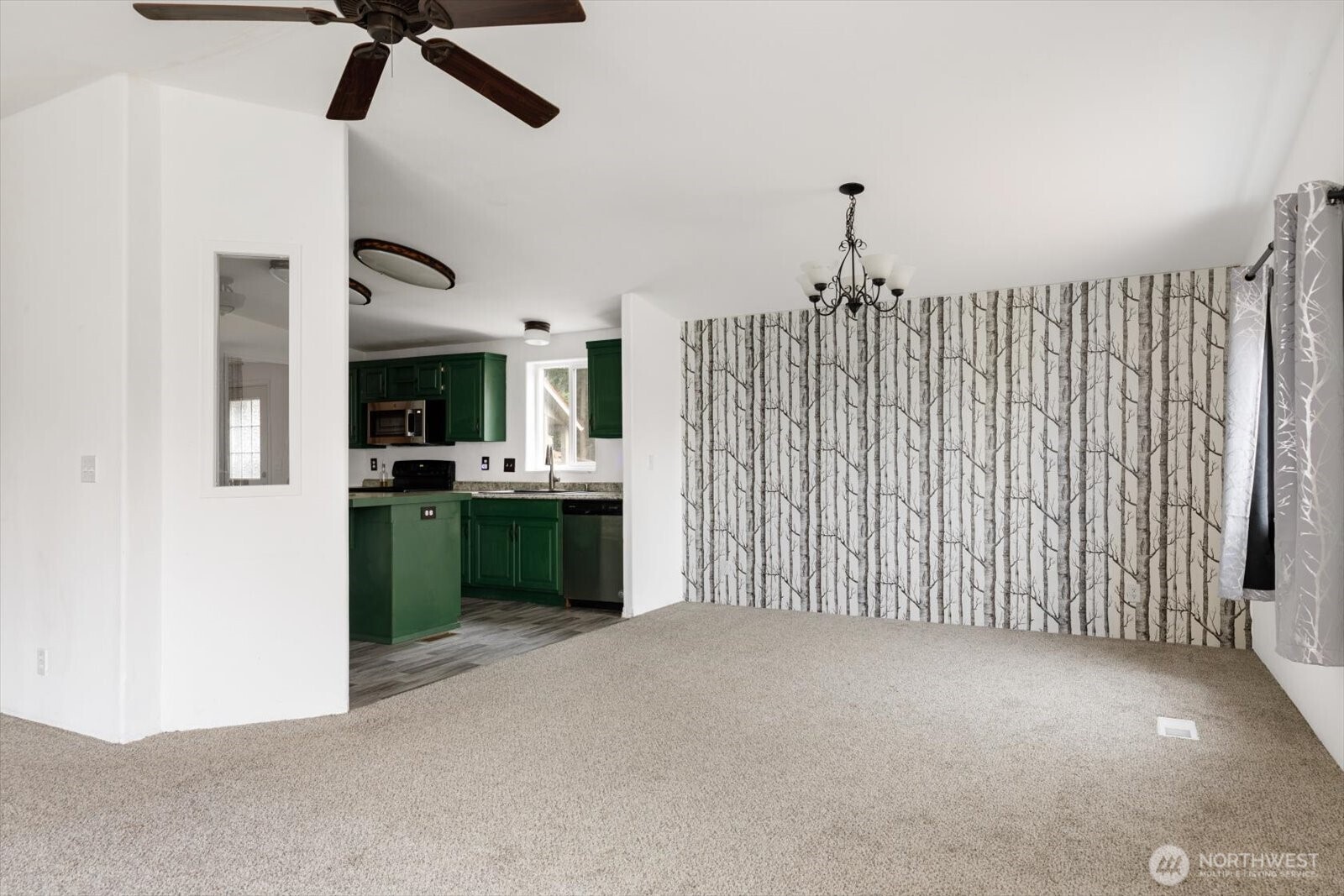 99 East Morris Road Coupeville, WA 98239 - Photo 12 of 32 a view of a kitchen with a sink cabinet and window