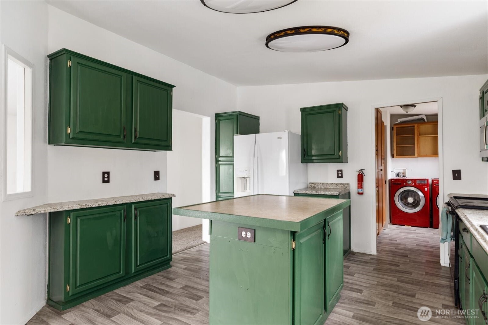 99 East Morris Road Coupeville, WA 98239 - Photo 16 of 32 a kitchen with stainless steel appliances granite countertop a sink and a microwave