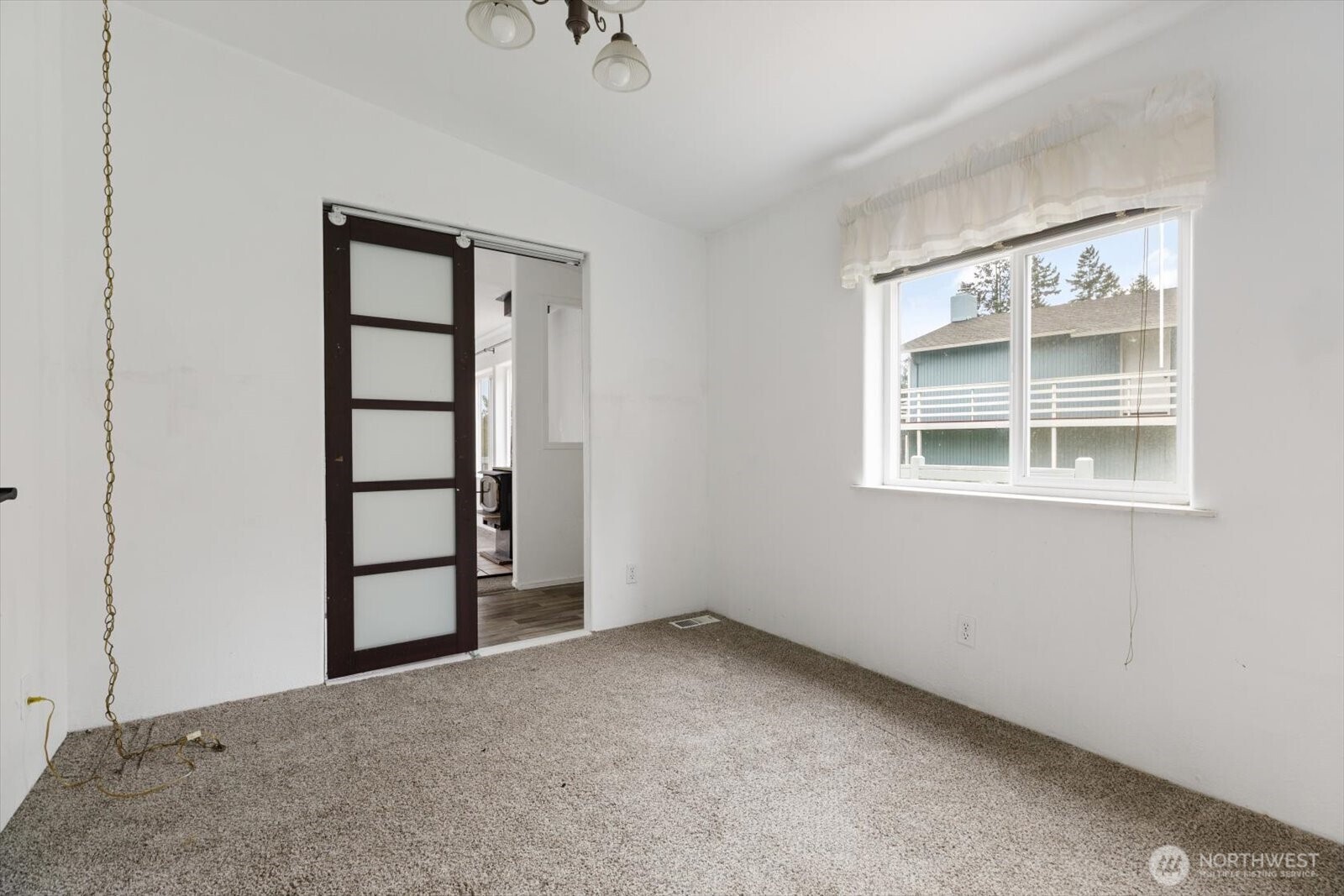 99 East Morris Road Coupeville, WA 98239 - Photo 20 of 32 an empty room with windows and closet