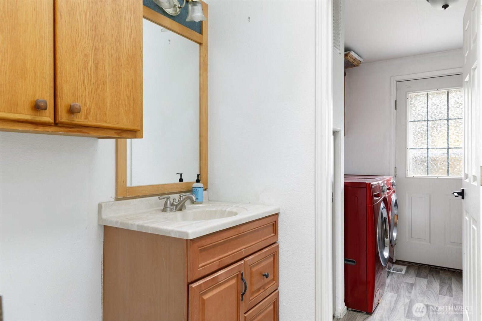 99 East Morris Road Coupeville, WA 98239 - Photo 22 of 32 a bathroom with a sink and a mirror