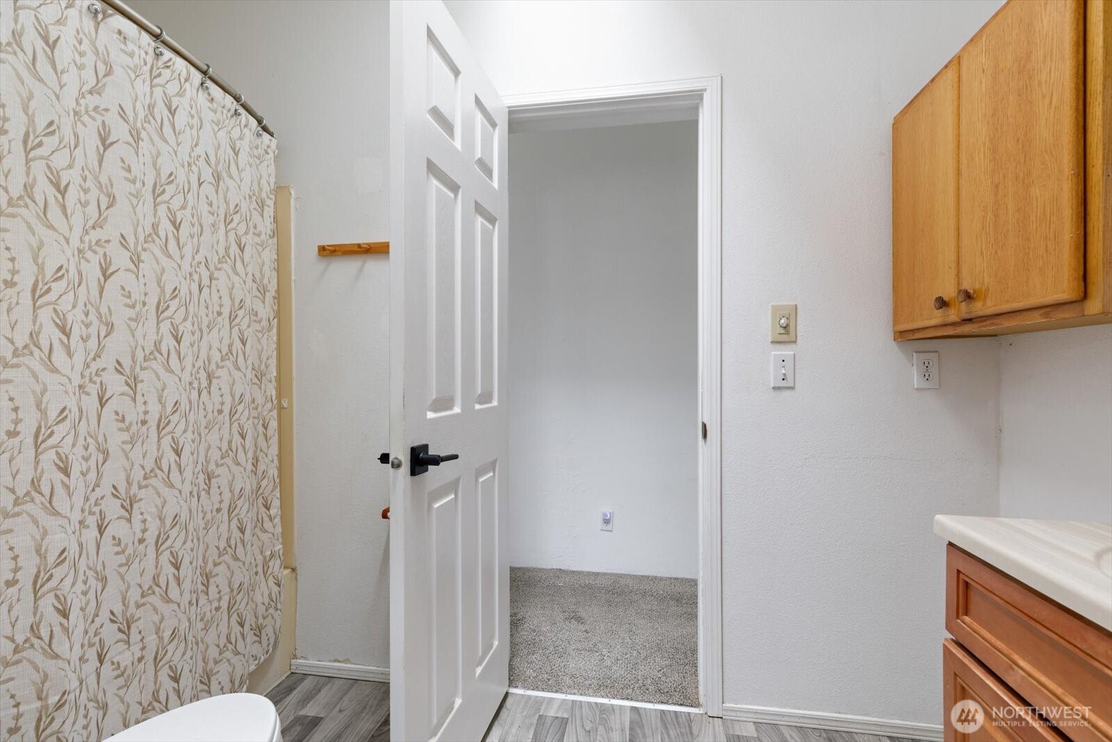 99 East Morris Road Coupeville, WA 98239 - Photo 23 of 32 a bathroom with a granite countertop sink and a mirror