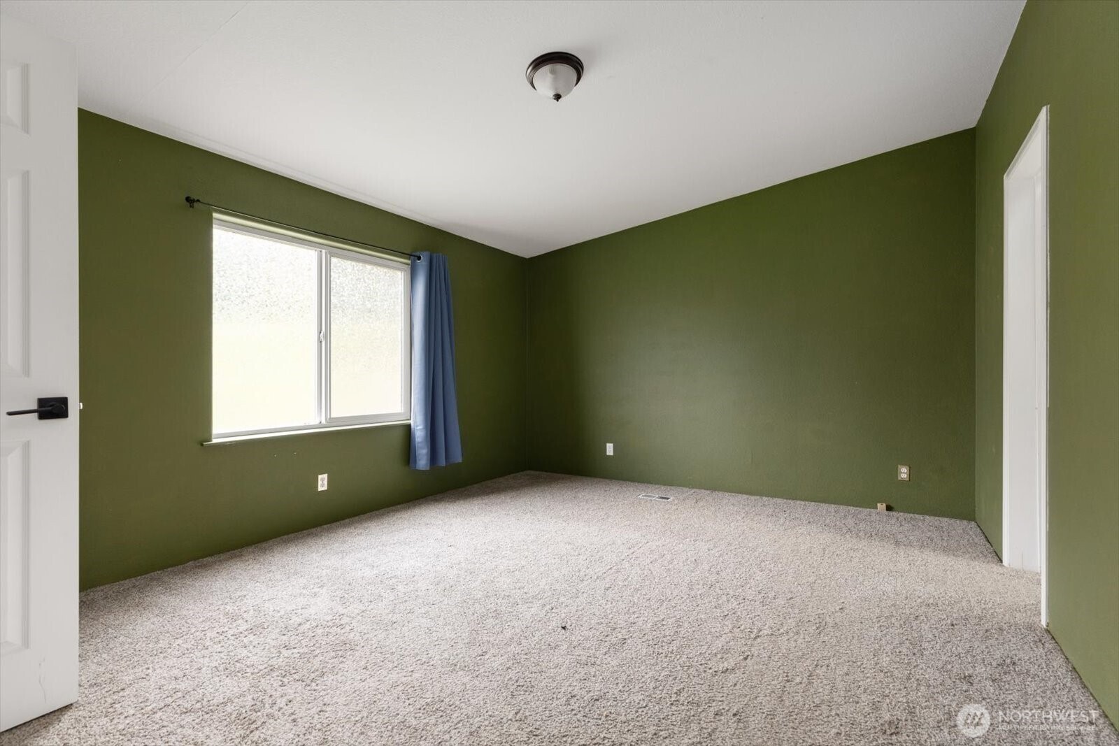 99 East Morris Road Coupeville, WA 98239 - Photo 25 of 32 a view of an empty room with a window and a bathroom