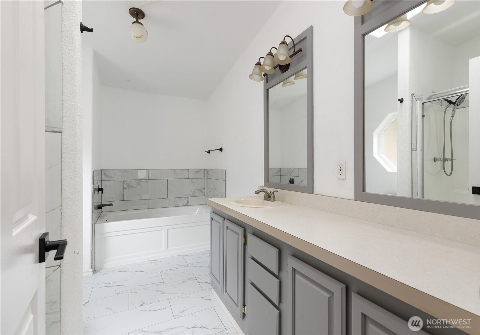 99 East Morris Road Coupeville, WA 98239 - Photo 27 of 32 a bathroom with a bathtub sink and mirror