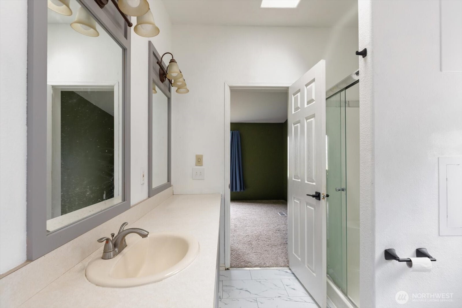 99 East Morris Road Coupeville, WA 98239 - Photo 28 of 32 a bathroom with a sink and a mirror