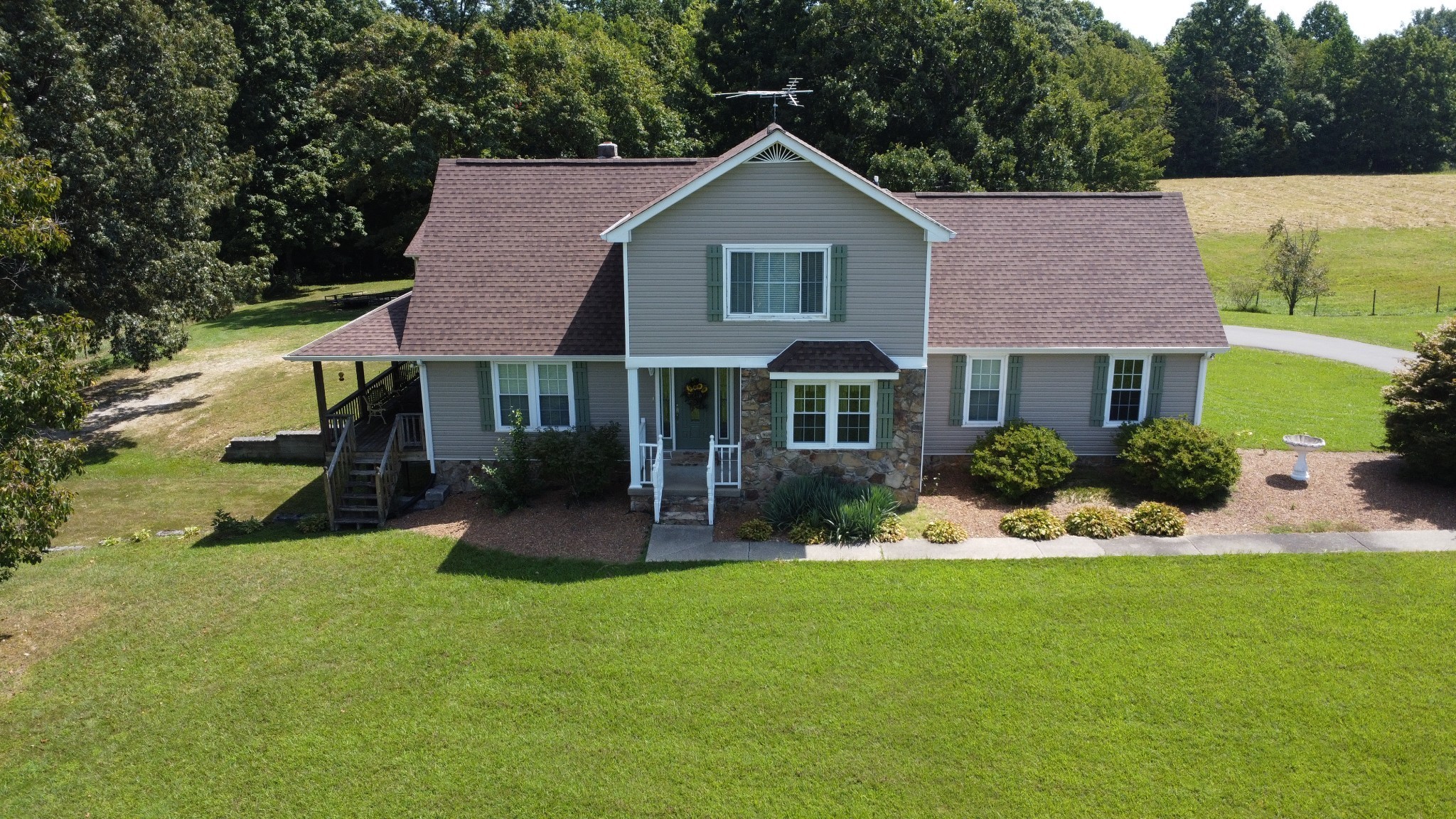 3 Carthage Road Red Boiling Springs, TN 37150 - Photo 8 of 15 a front view of a house with a yard table and chairs