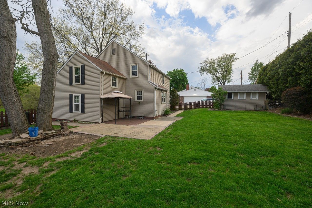 1422 Monument Road Northwest Canton, OH 44703 - Photo 28 of 31 Back of home with patio area and beautiful landscaping