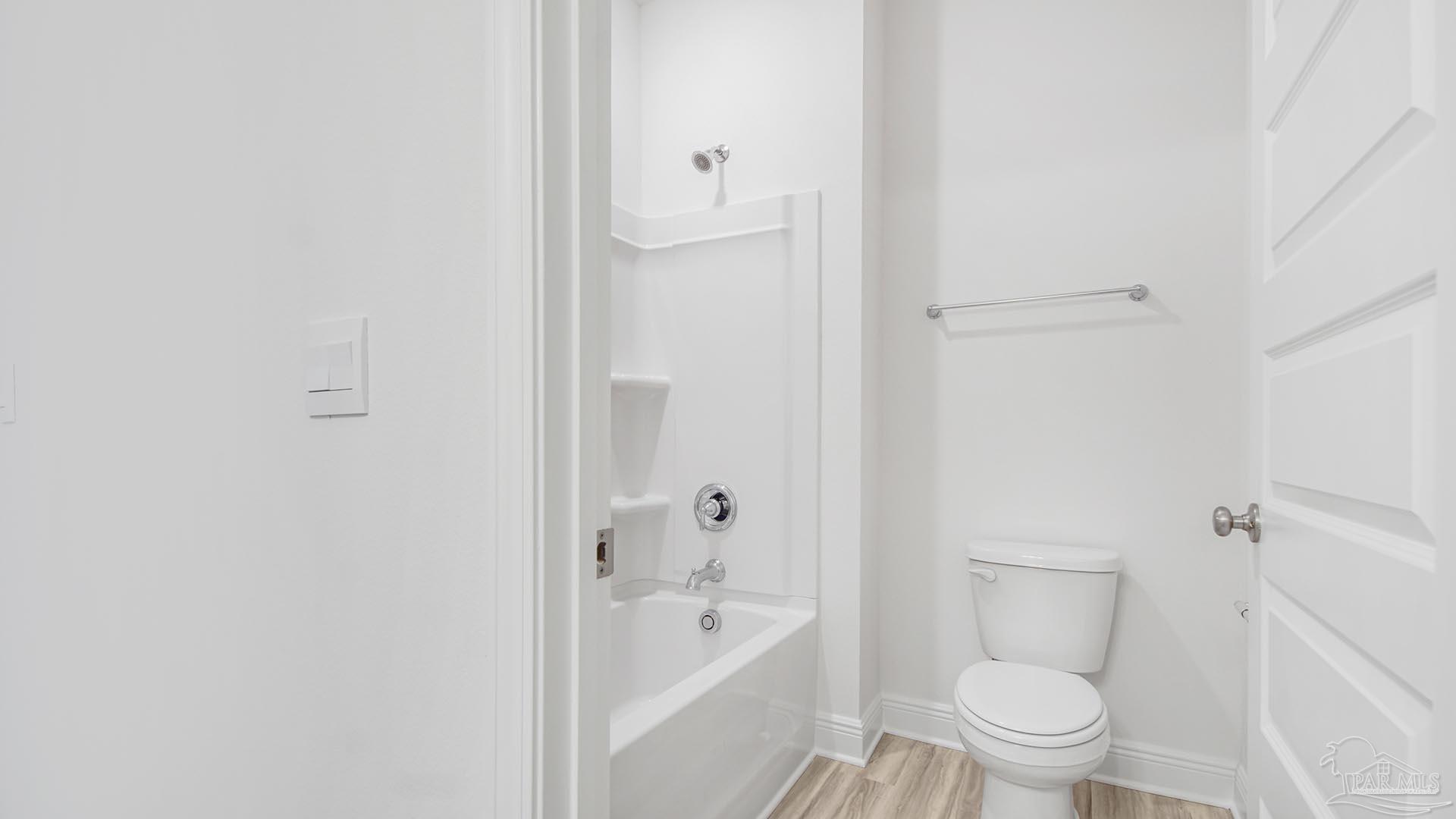 3233 Harrier Road Pace, FL 32571 - Photo 23 of 50 a bathroom with a toilet and a bathtub