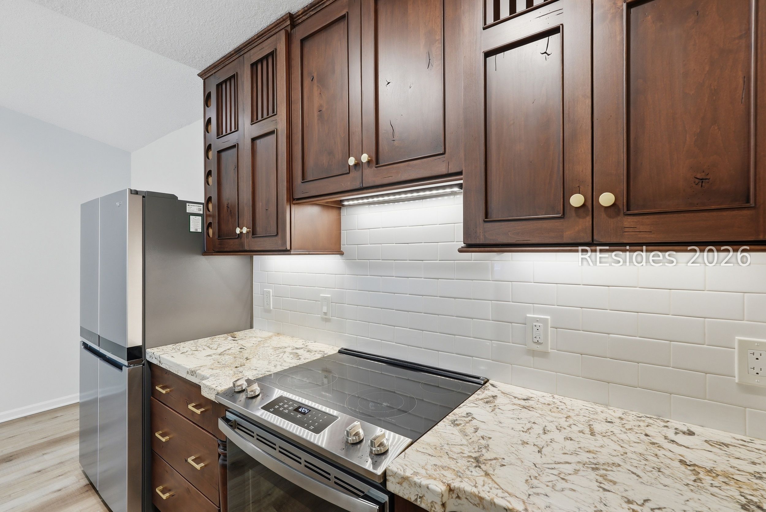 897 Fording Island Road, Unit 1303 Bluffton, SC 29910 - Photo 12 of 48 Under cabinet lighting and stainless appliances.