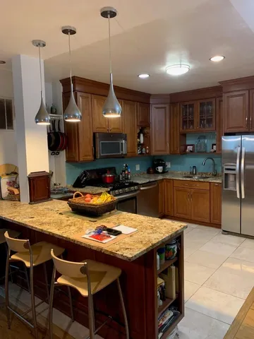 a bedroom with a bed next to a window