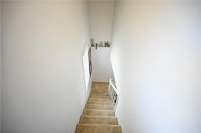 a view of a hallway with stairs