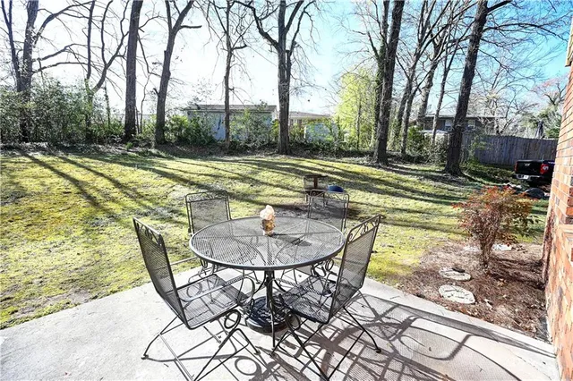 a view of a swimming pool with a patio