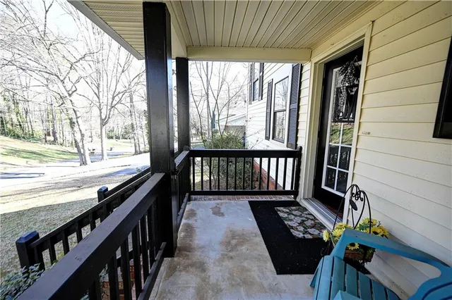 a view of balcony with wooden floor
