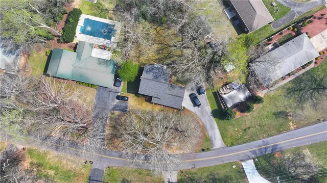 a view of a city with lush green forest