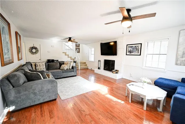 a living room with furniture and a flat screen tv