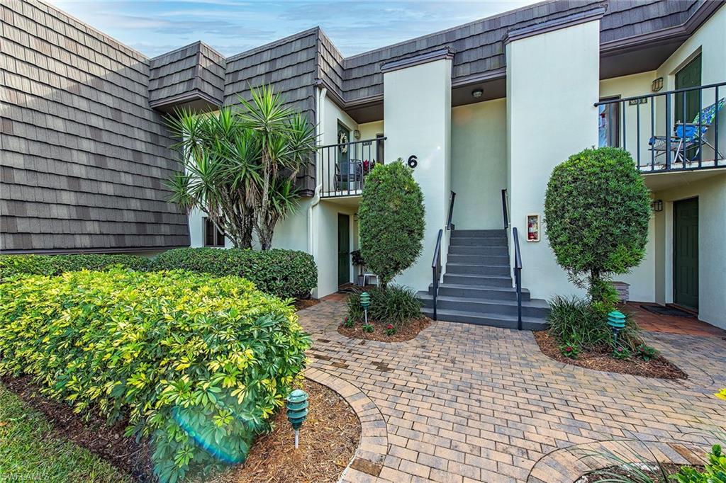 1672 Spoonbill Lane, Unit 1672 Naples, FL 34105 - Photo 1 of 12 a front view of a house