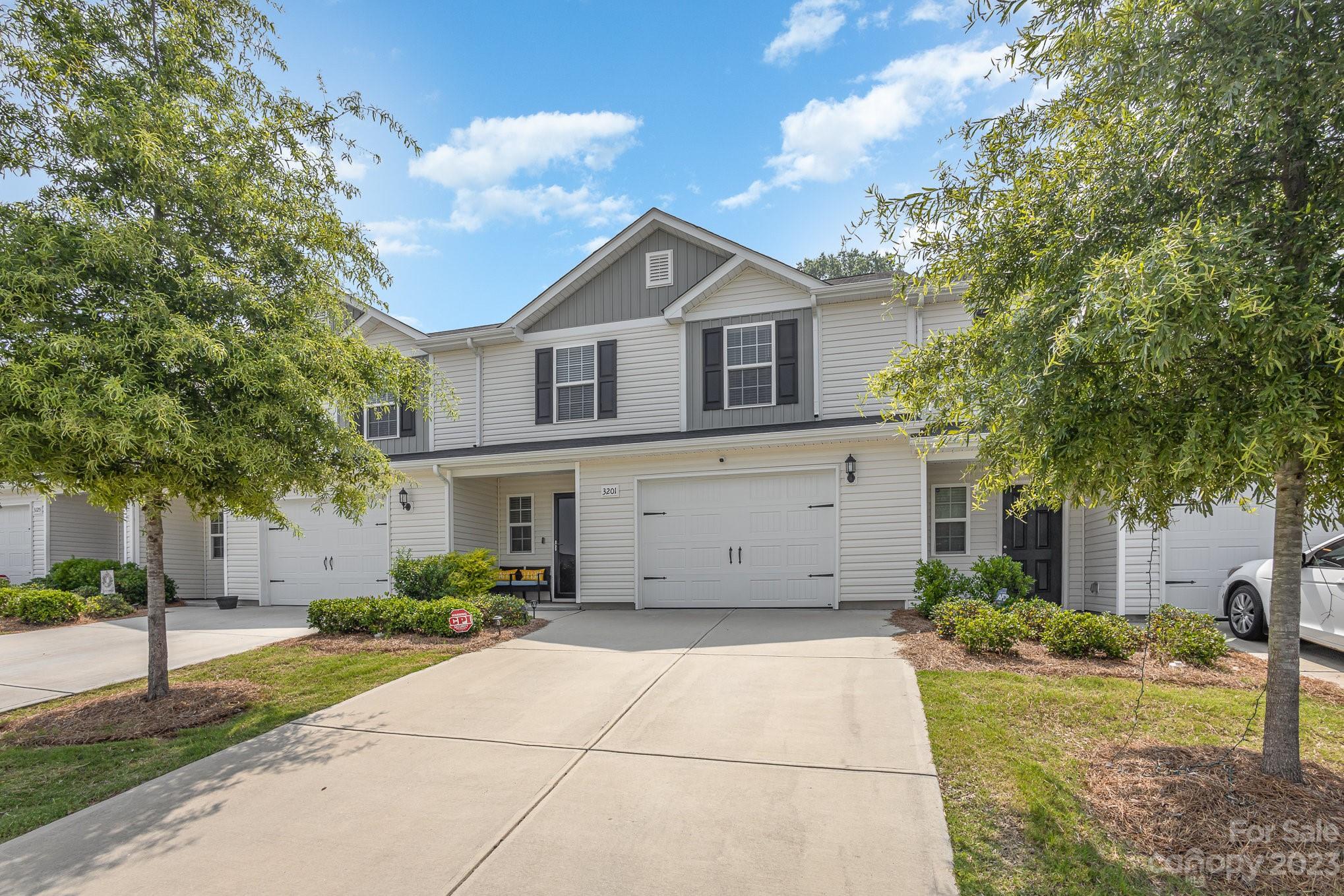 3201 Ellingford Road Charlotte, NC 28214 - Photo 1 of 29 a front view of a house with garden
