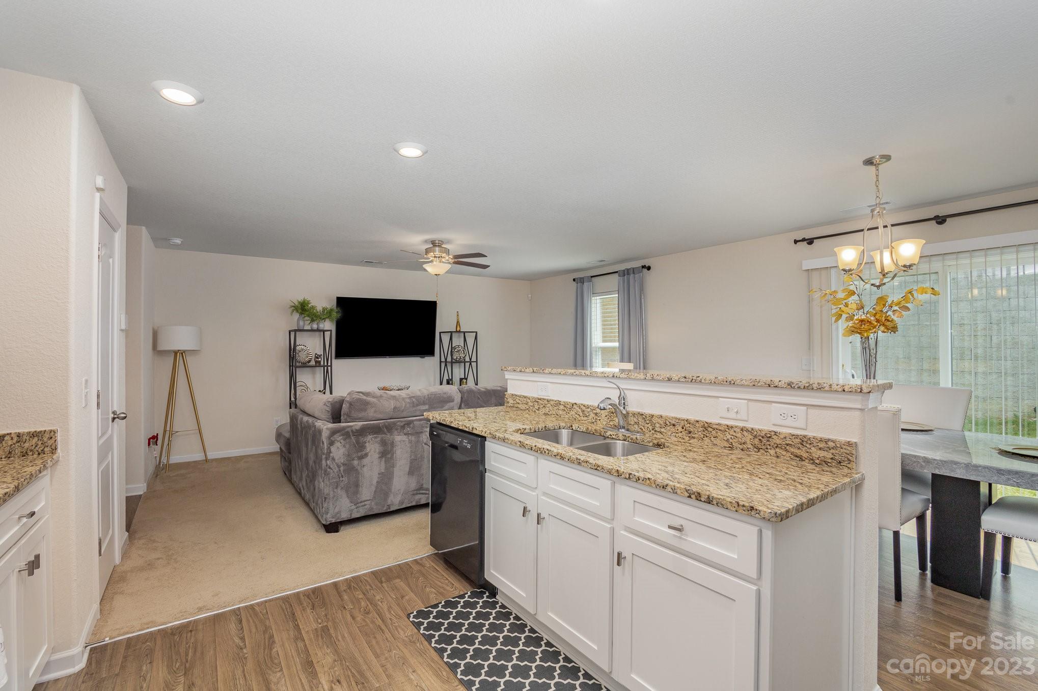 3201 Ellingford Road Charlotte, NC 28214 - Photo 12 of 29 a view of living room with granite countertop furniture and a fireplace