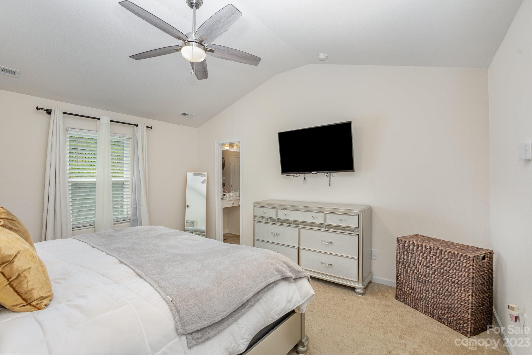3201 Ellingford Road Charlotte, NC 28214 - Photo 18 of 29 a bedroom with a bed and a flat screen tv