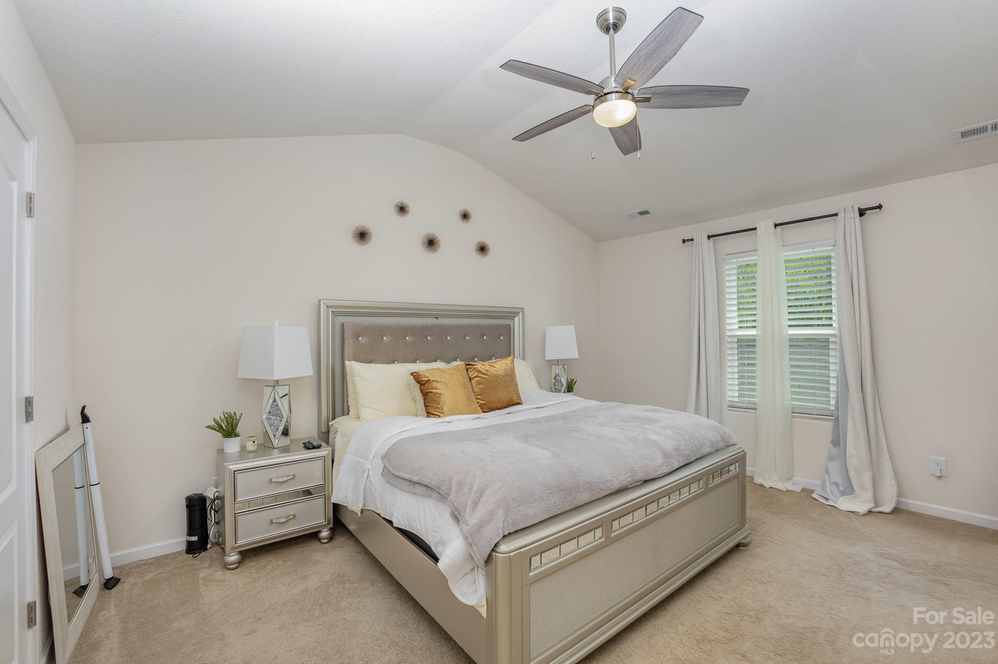 3201 Ellingford Road Charlotte, NC 28214 - Photo 19 of 29 a bedroom with a bed and a ceiling fan